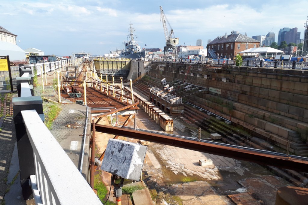 Empty Dry Dock #1 with WW II destroyer USS Cassin Young and Boston skyline in the background