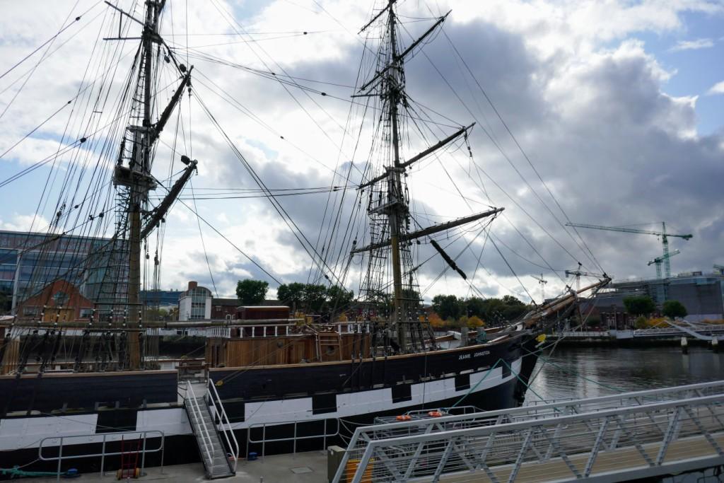 The Jeanie Johnston, a 2002 reproduction of an 1847 cargo ship, used to carry fleeing Irish emigrants to North America, moored on the River Liffey in central Dublin.