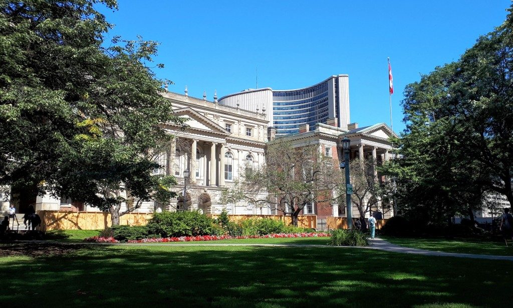 Osgoode Hall's centre section (left, late 1850s) and red brick east section (right, 1832) with Toronto's City Hall (1965) behind