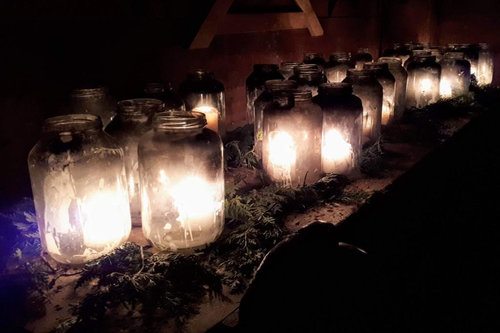 Candles in jars and green boughs in Boivin House at Sainte-Marie Among the Hurons. Some of the 5,000 lights on display during the First Light celebration.